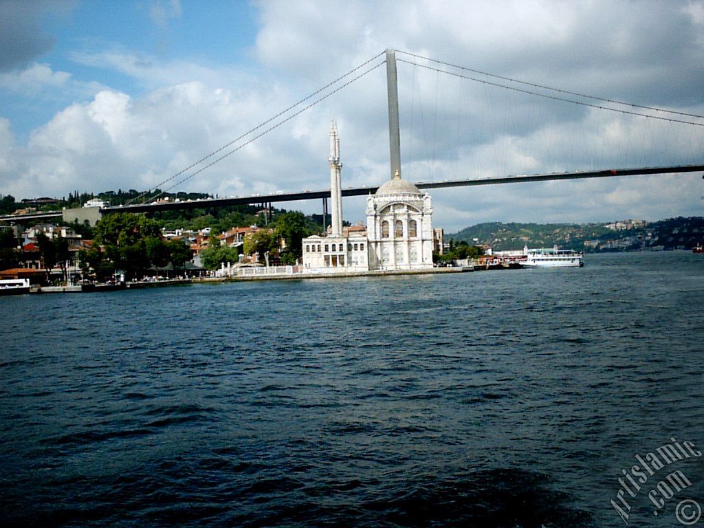 View of Ortakoy coast, Ortakoy Mosque and Bosphorus Bridge from the Bosphorus in Istanbul city of Turkey.
