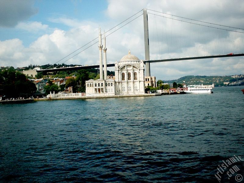 View of Ortakoy coast, Ortakoy Mosque and Bosphorus Bridge from the Bosphorus in Istanbul city of Turkey.
