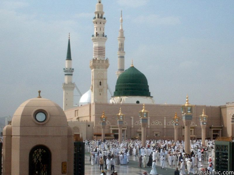 The Prophet Muhammad`s (saaw) Mosque (Masjed an-Nabawe) in Madina city of Saudi Arabia and the muslims going out of mosque after a prayer time.
