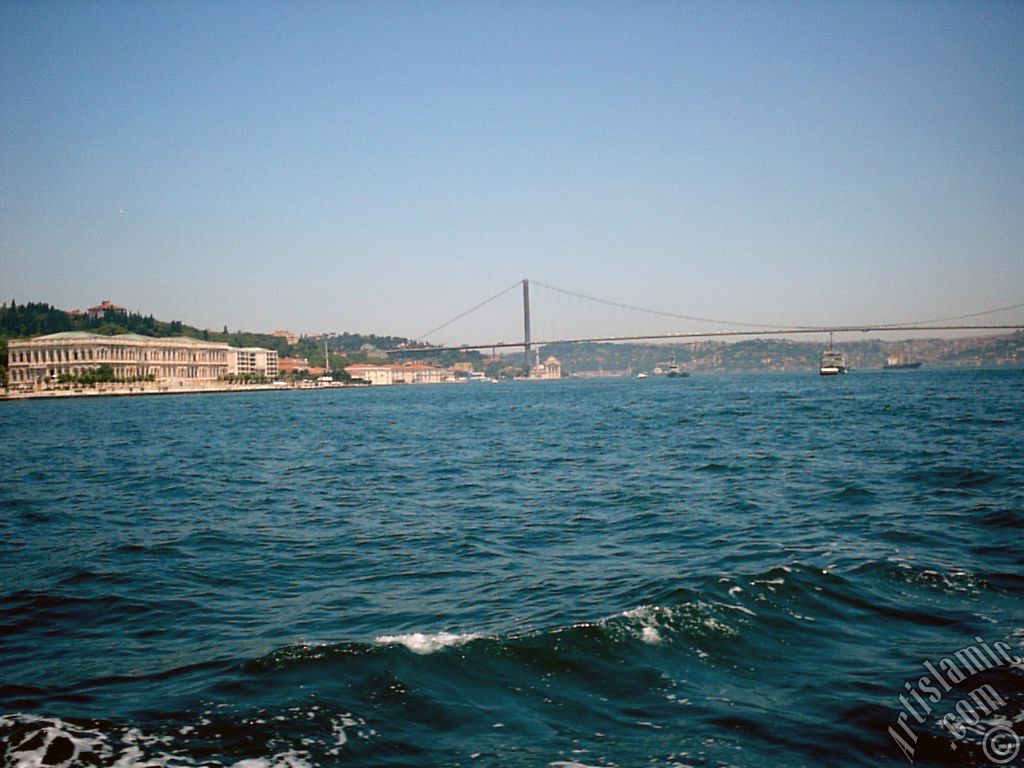 View of the Ciragan Palace and the Bosphorus Bridge from the Bosphorus in Istanbul city of Turkey.
