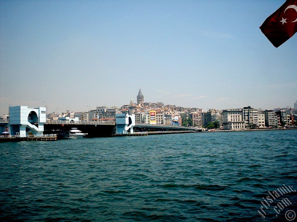 View of Karakoy coast, Galata Bridge and Galata Tower from the shore of Eminonu in Istanbul city of Turkey.
