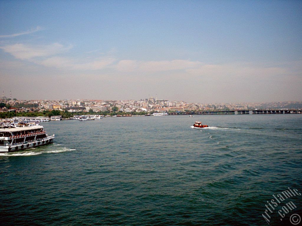 View of Sarachane coast, on the horizon on the left Fatih Mosque and in the middle Yavuz Sultan Selim Mosque from Galata Bridge located in Istanbul city of Turkey.
